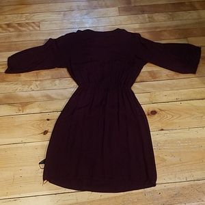 A maroon button up dress